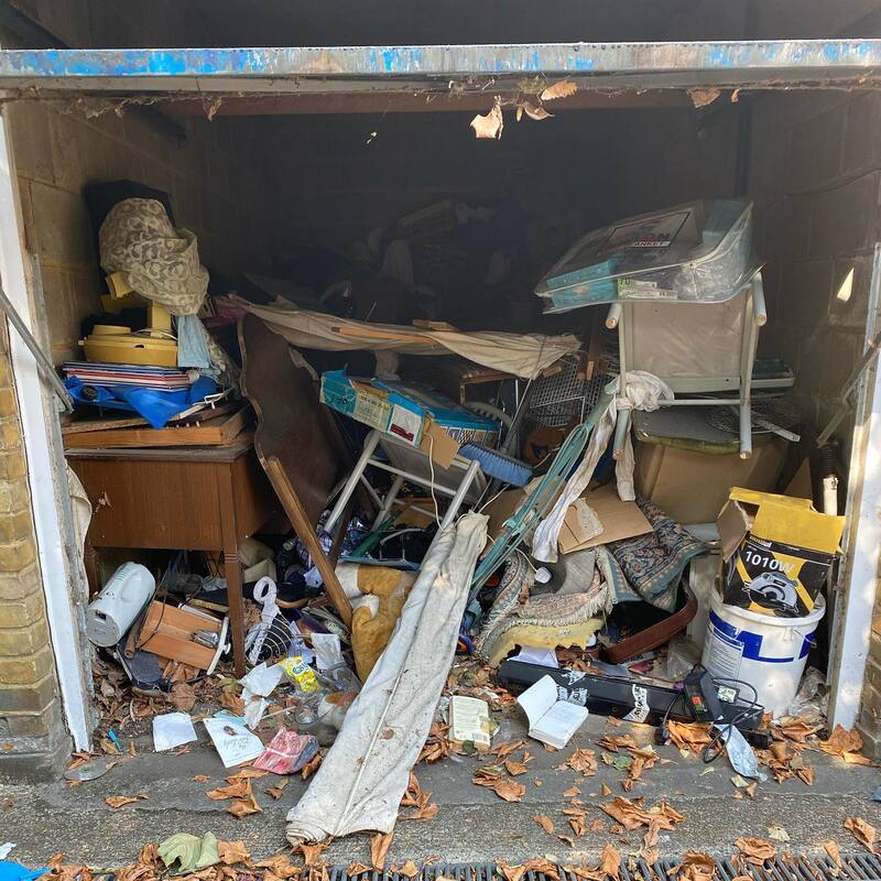 Garage full of junk before clearance